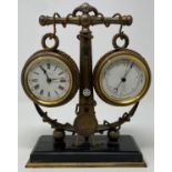 An early 20th century novelty desk set, incorporating a timepiece, a thermometer and an aneroid