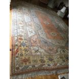A Persian type red ground carpet, multiple borders centre with repeating foliate forms, 340 x 476 cm
