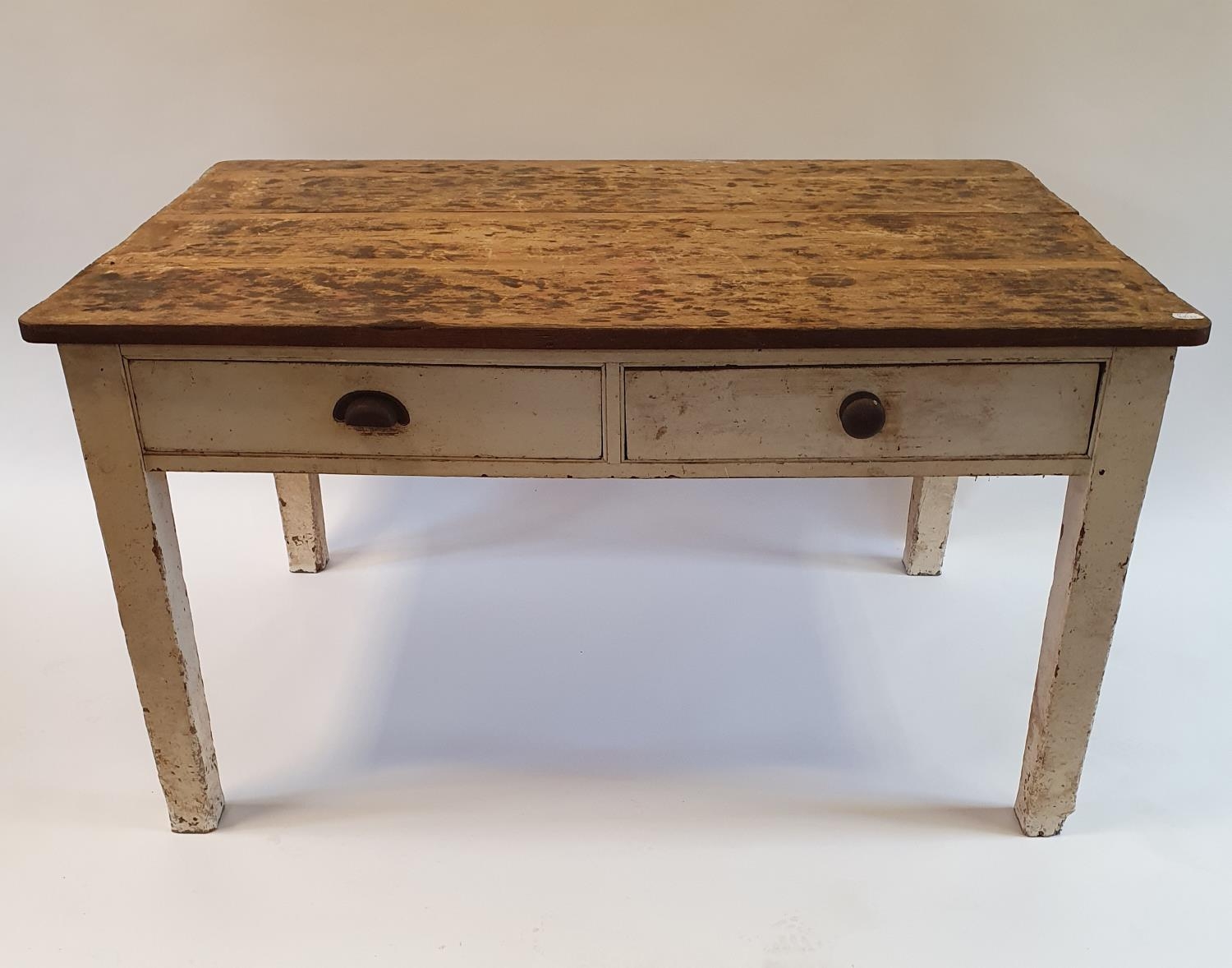 A pine kitchen table, having two drawers, on square legs, 142 cm wide