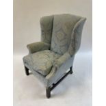 A George III style wing armchair