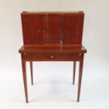 A 19th century inlaid mahogany ladies writing desk, the superstructure with three cupboard doors and