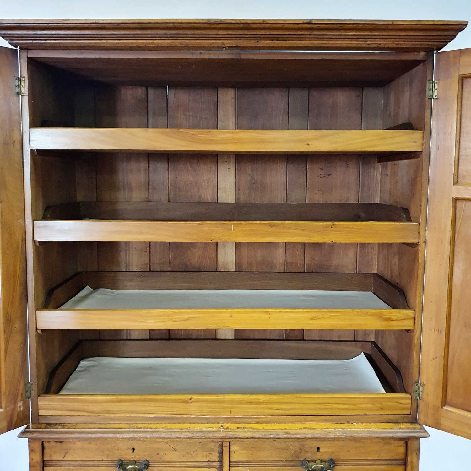 An early 20th century walnut linen press, with two doors, to reveal slides, on a base with two - Image 3 of 7