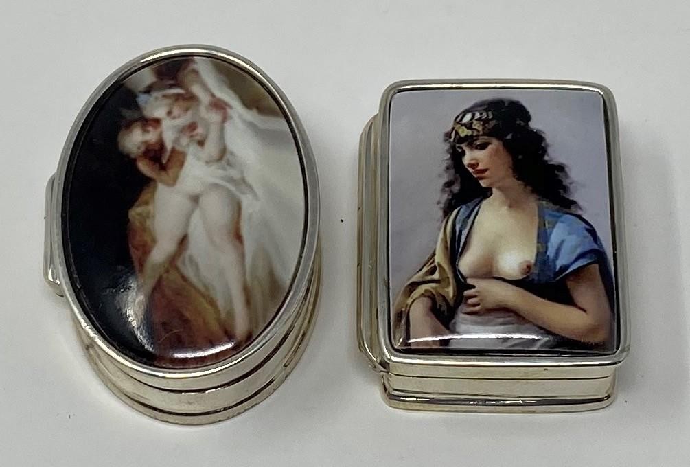 A silver and enamel pillbox, decorated a nude, and another (2) This is a modern copy