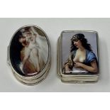 A silver and enamel pillbox, decorated a nude, and another (2) This is a modern copy