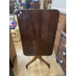 A 19th century mahogany tripod table, 92 x 60 cm, and a walnut base of a music cabinet (2)