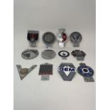 Assorted car badges, including RREC, Jowett Car Club 1923, The Order of the Road, 44 Year Driver,