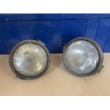 A large pair of early 20th century headlamps, 27 cm diameter, other lamps and items (qty) one of hte