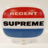 A Regent Supreme opaque glass petrol pump globe, one side more faded than the other, chips and