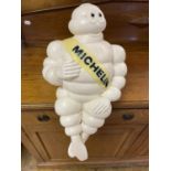 A Michelin Man advertising plastic figure, seated, 47 cm high