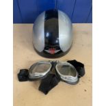 A Davida Moto pudding basin helmet, silver with a black stripe, and a pair of goggles