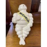 A Michelin Man advertising plastic figure, seated, 47 cm high