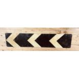 A chevron road sign, 40 x 183 cm