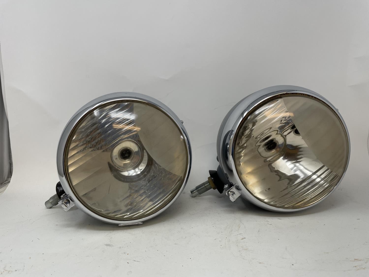 Four headlamps, understood to be from a pre-war Ford, and four other headlamps (2 boxes)