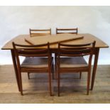 A 1970s teak extending dining table, with an extra leaf, and six matching dining chairs (8) Table