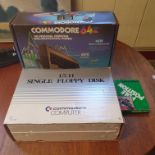 A Commodore 64 home computer, boxed USA model, a 1541 Single Floppy Disk player, boxed USA model,