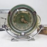 An Art Deco mantel clock, in a chrome case, 16 cm high, 18 cm wide and three others (4) The Art Deco