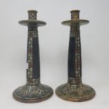 A pair of Doulton Lambeth stoneware candlesticks, decorated flowers, 32 cm high Some rough areas
