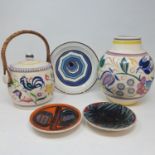 A Poole vase, decorated flowers, 21 cm high and various Poole pottery (qty)
