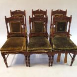A set of six walnut chairs, carved in the manner of Bruce Talbot (6)