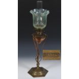 A Benson copper and brass oil lamp, stamped mark to base, with a vaseline glass shade, 75 cm high