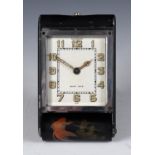 A Jaeger-Le coultre travelling timepiece, the 4.5 cm wide silvered dial with Arabic numerals, in a