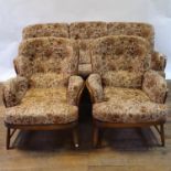An Ercol three piece suite Upholstery, stained and worn, appears to be original. Frame
