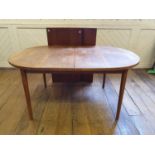 A Danish teak extending dining table, with two extra leaves, by Troeds, stamped Table 155 cm wide