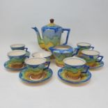 A Hancocks Ivory Ware Art Deco coffee set, with bold decoration, comprising a coffee pot, six cups