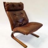 A rosewood and brown leather chair