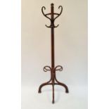 A Thonet bentwood coat stand, impressed mark and paper label to base, 204 cm high Overall