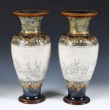 A large pair of Royal Doulton vases by Hannah Barlow, the central band of incised decoration,
