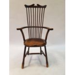 An early 20th century stick back elm chair Total Height 118 cm Total Width 62 cm Height to seat 47