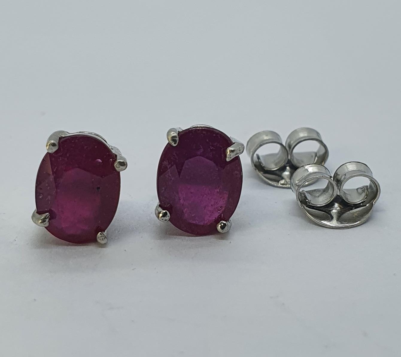 A pair of ruby stud earrings Treated rubies