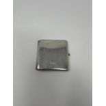 A silver cigarette case, inscribed, and with a cabochon sapphire button, 4.0 ozt, 9 cm
