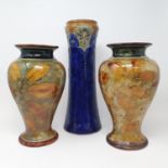 A pair of Royal Doulton leaf pattern stoneware vases, 27 cm high, and another Royal Doulton vase, 33