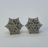 A pair of 9ct gold and diamond daisy earrings