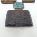A 19th century treen snuff box, the top carved with stylised foliate fawns, 10 cm wide, and five