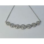 An 18ct white gold pendant necklace, set with 40 points of diamonds