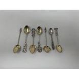 A Chinese silver spoon, decorated character marks, and six other Chinese silver spoons (7)