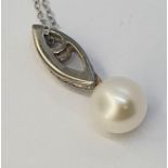 A 9ct white gold, diamond and pearl pendant, on a chain