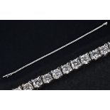 An 18ct white gold and diamond line bracelet Total diamond weight 2.50ct approx. Diamonds 1.97 mm