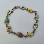 A child's bracelet, decorated dogs and elephants in enamel colours 15 cm long 4.6 g