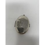 A Dutch silver coloured metal oval pill box, 6 cm wide Converted to a locket