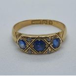 An 18ct gold, sapphire and diamond ring, ring size M