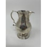 A George II silver cream jug, London 1750, 3.5 ozt, 10 cm high, Spout with slight droop,