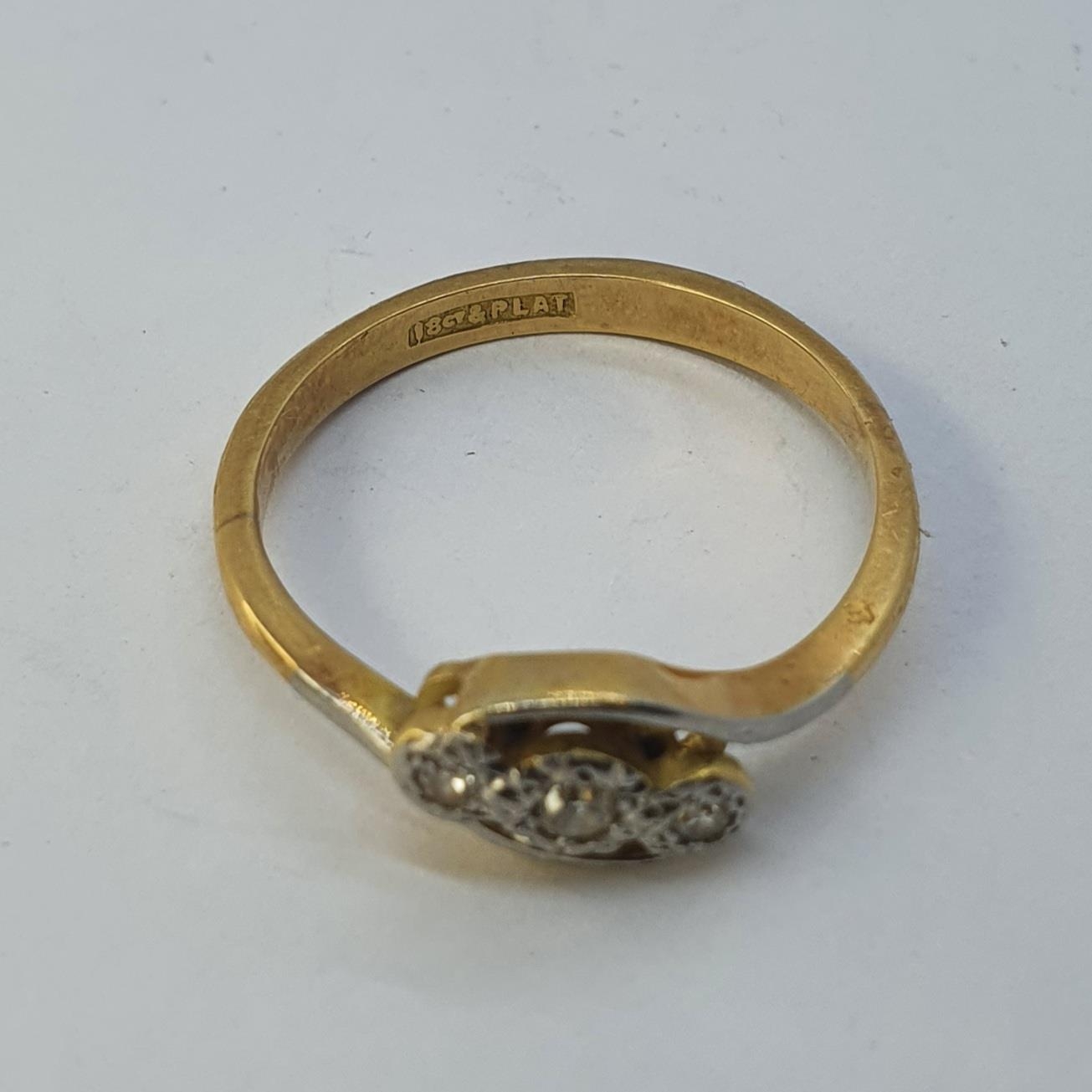 An 18ct gold and three stone diamond ring, ring size N All in 2.9g - Image 2 of 3