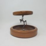An Art Deco silver plated and turned wood two tier stand, in the form of a dancing lady, 26 cm