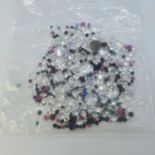 Various loose mixed stones, including cubic zirconia, sapphire, ruby and emeralds Total weight