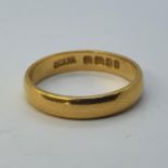 A 22ct gold wedding band, 5.3 g Ring size P1/2