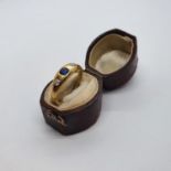 A 9ct gold, sapphire and diamond gypsy set ring, ring size K, and a early 20th century leather